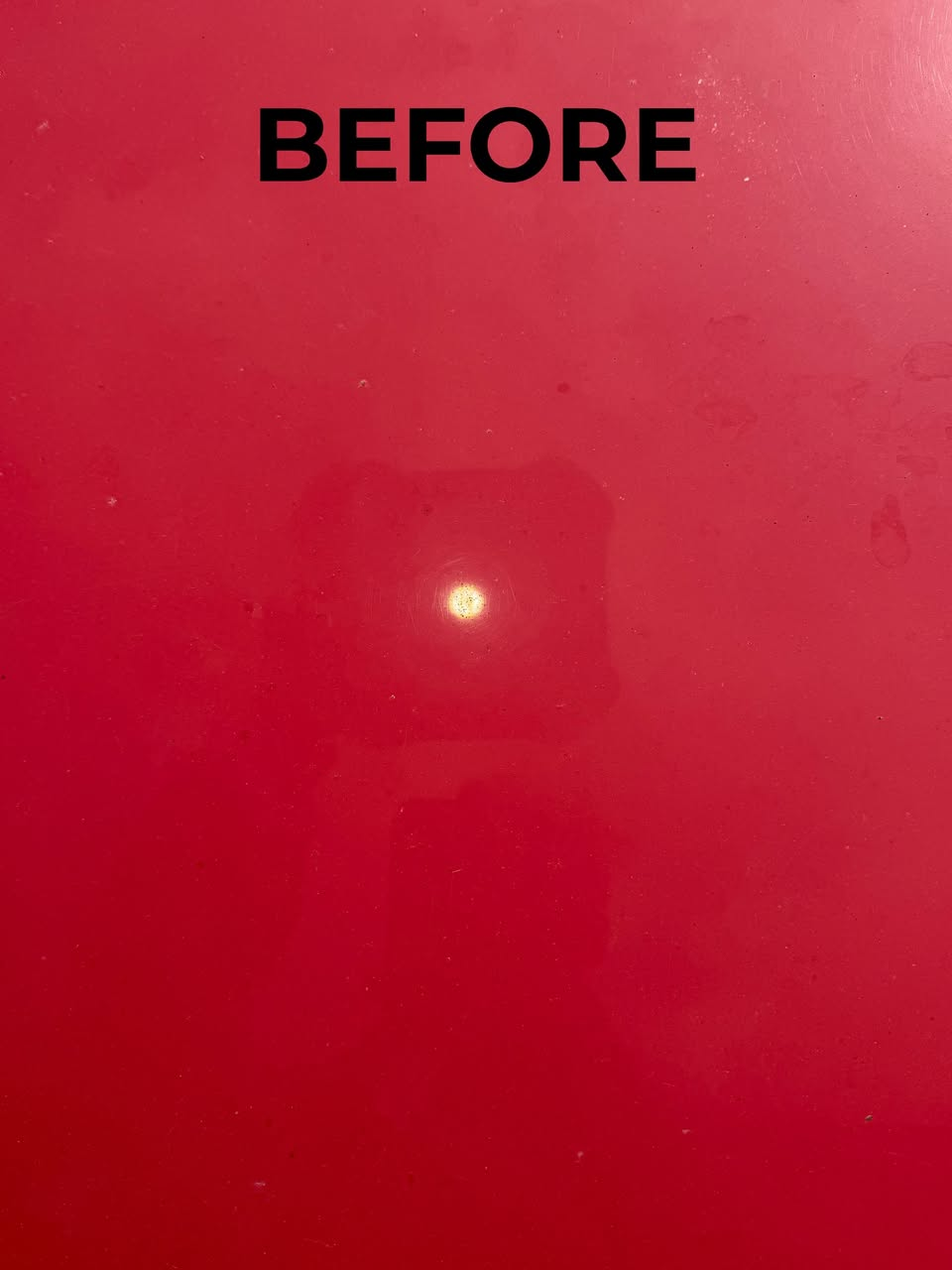 Swirl marks and holograms on red paint before ceramic coating